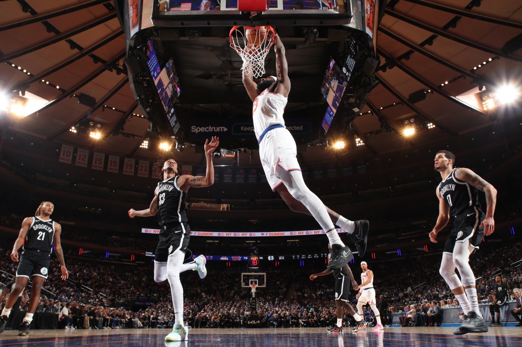 Mitchell Robinson dunks the ball against the Brooklyn Nets on January 21, 2026 at Madison Square Garden in New York City, New York. 