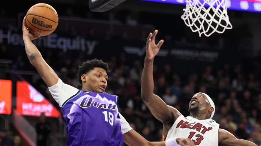 Ace Bailey #19 of the Utah Jazz passes over Bam Adebayo #13 of the Miami Heat...