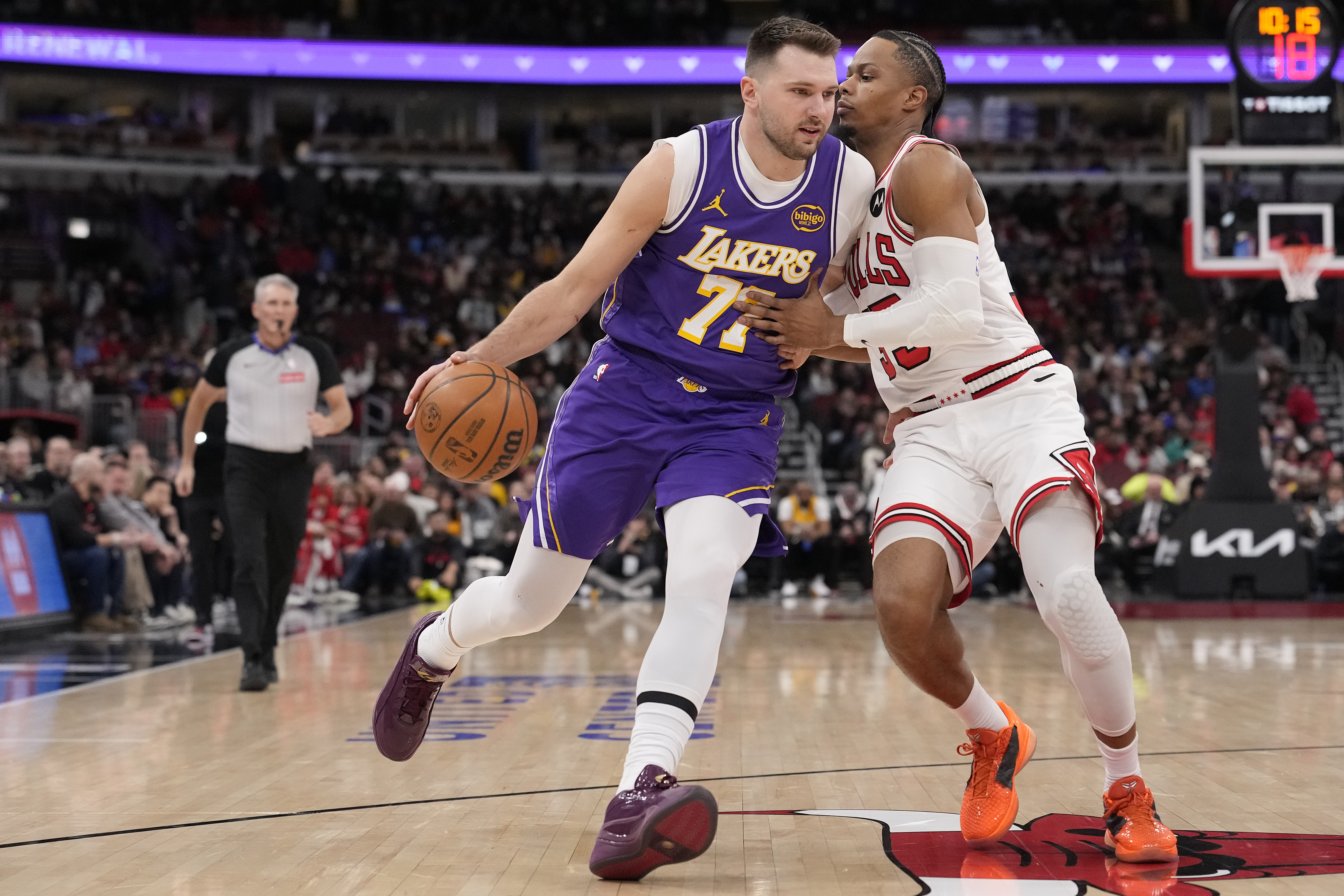 Lakers star Luka Doncic drives as the Chicago Bulls’ Isaac...