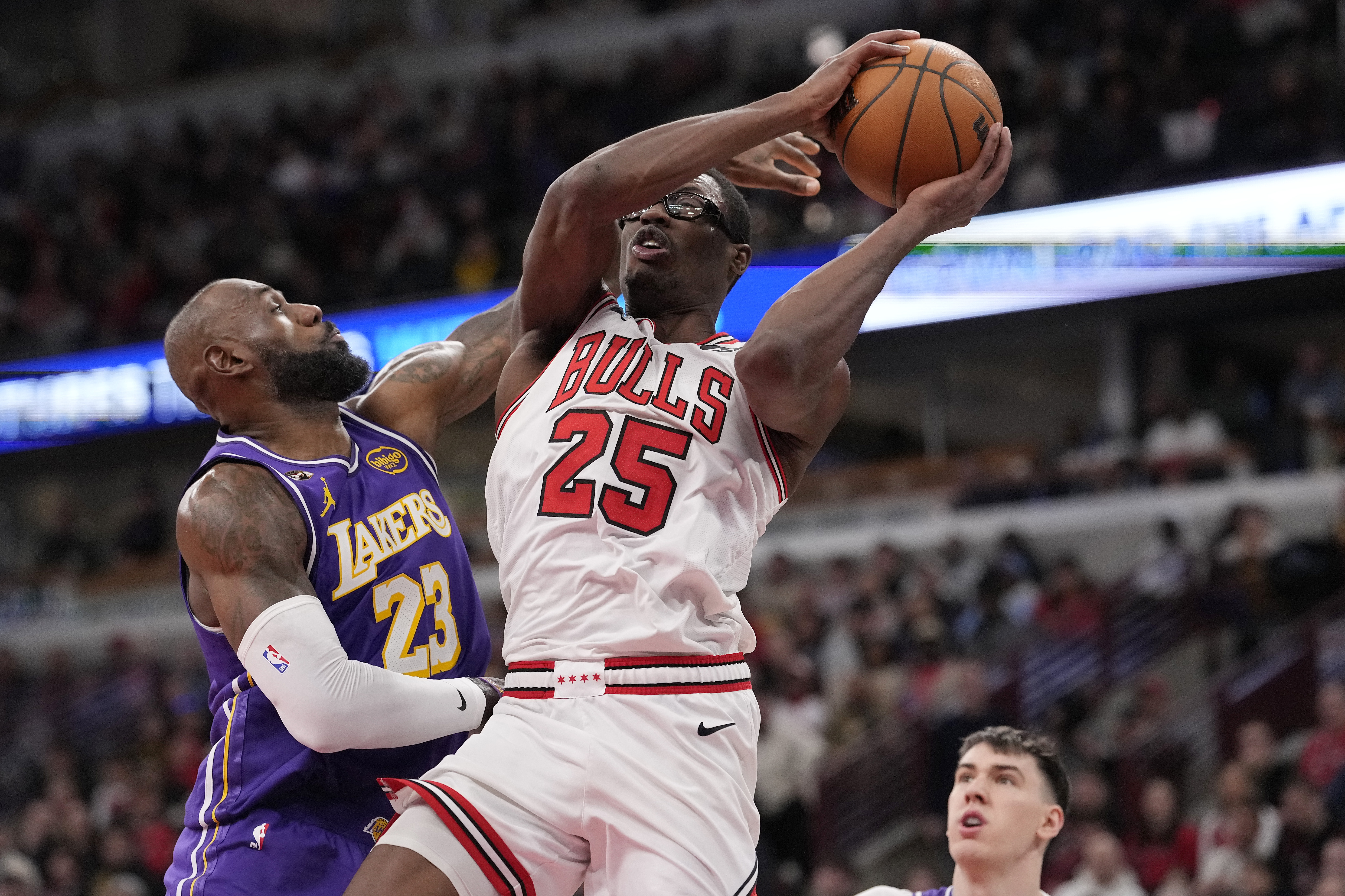 Lakers star LeBron James, left, fouls the Chicago Bulls’ Jalen...