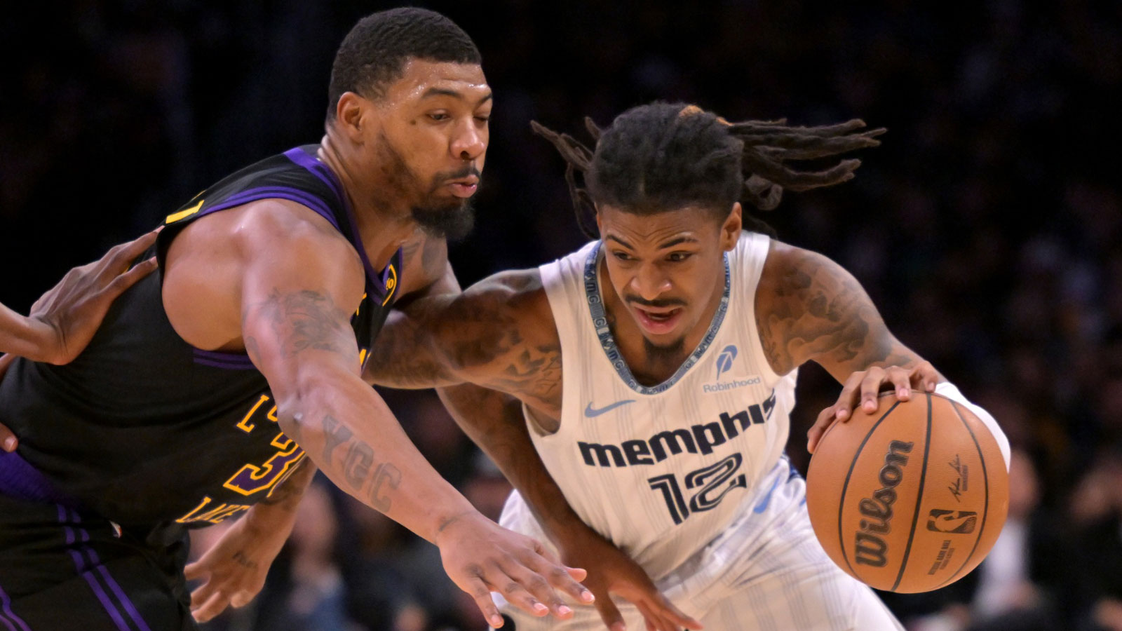 Los Angeles Lakers guard Marcus Smart (36) defends Memphis Grizzlies guard Ja Morant (12) as he drives to the basket in the second half at Crypto.com Arena.