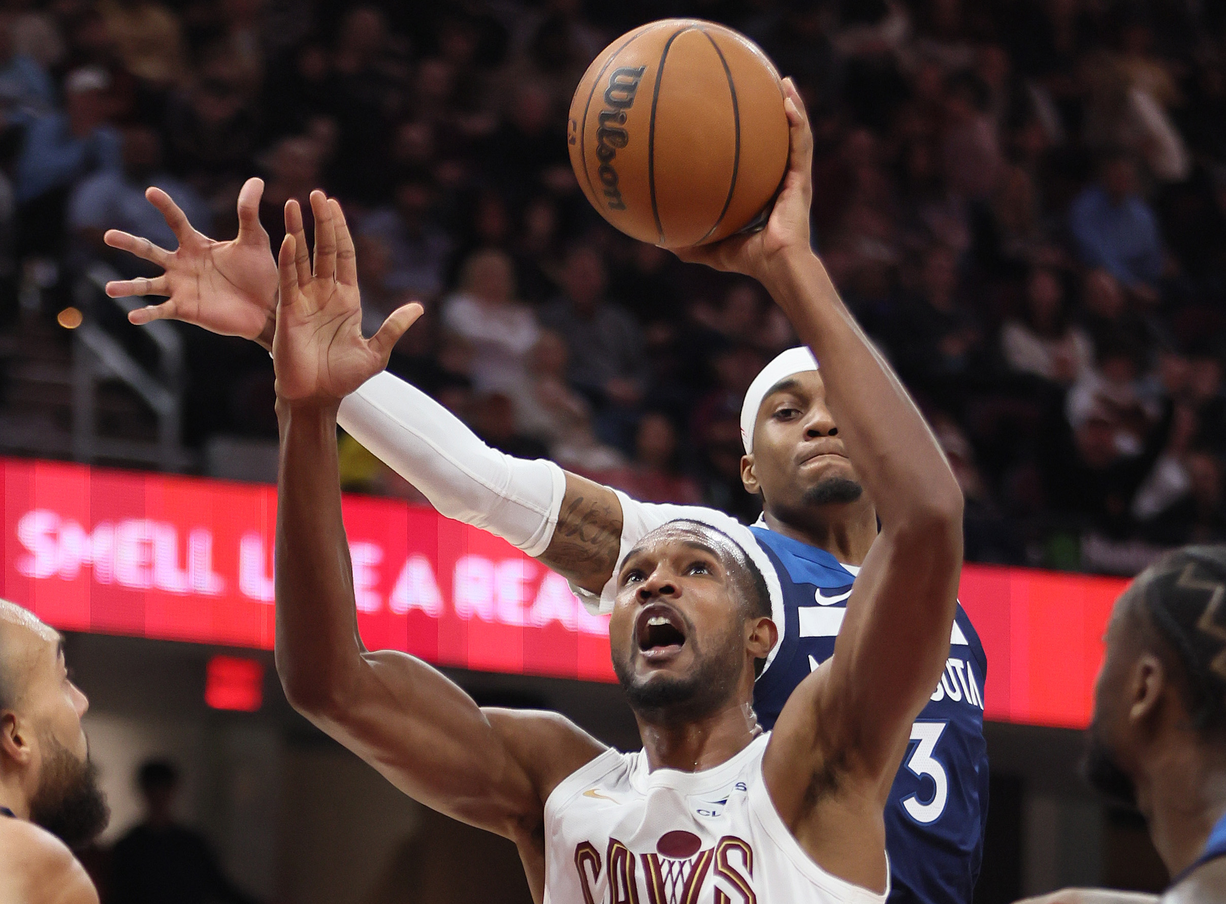 Cleveland Cavaliers center Evan Mobley goes up for a dunk as Minnesota Timberwolves forward Jaden McDaniels tries for the block in the second half. 
