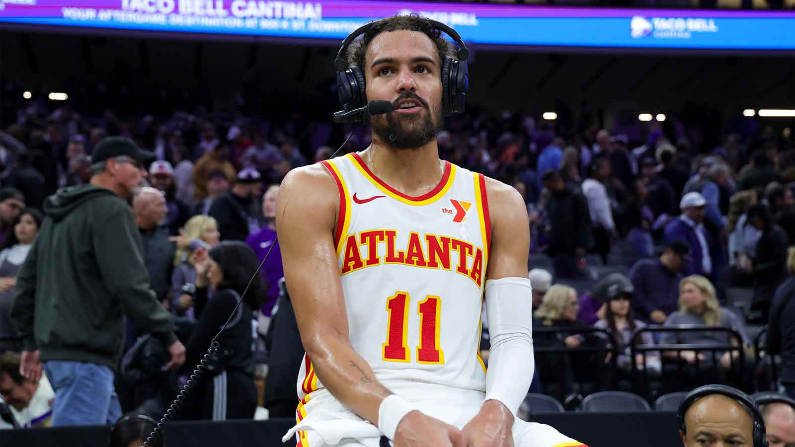 Hawks guard Trae Young (11) is interviewed by media after the game against the Sacramento Kings at Golden 1 Center