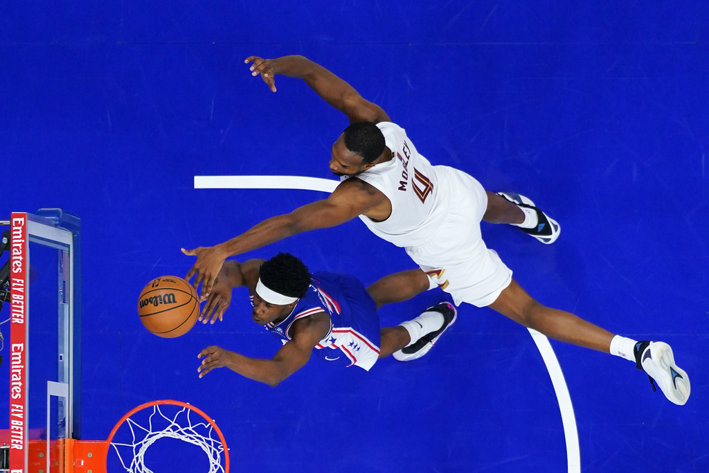 Cleveland Cavaliers' Evan Mobley, right, blocks a shot by Philadelphia 76ers' Vj Edgecombe during the second half of an NBA basketball game Wednesday, Jan. 14, 2026, in Philadelphia. 
