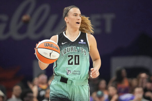 FILE - New York Liberty guard Sabrina Ionescu controls the ball against the Phoenix Mercury during the second half of Game 1 during the first round of the WNBA basketball playoffs Sept. 14, 2025, in Phoenix. (AP Photo/Darryl Webb, File)