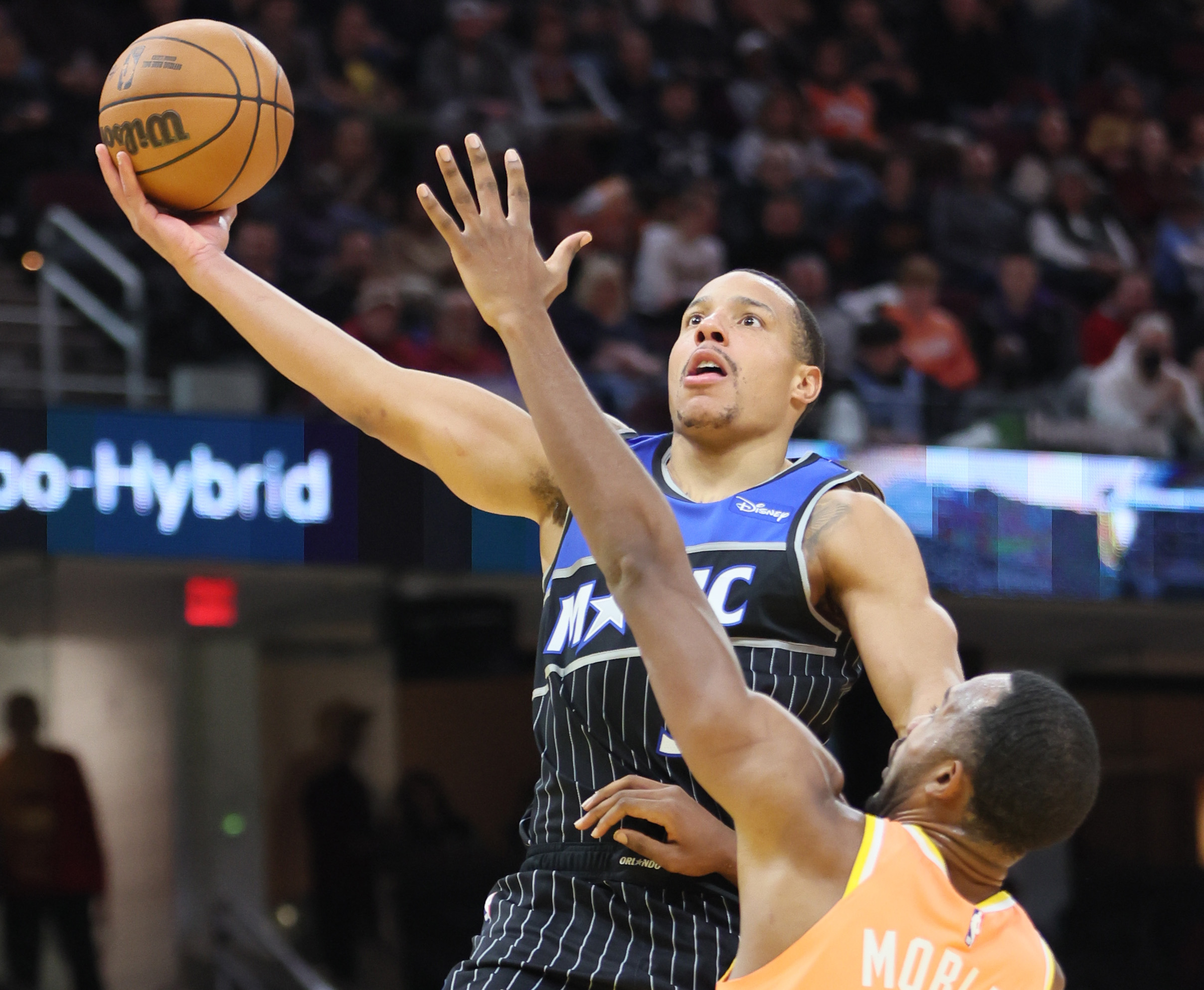 Orlando Magic guard Desmond Bane drives to the basket for a score guarded by Cleveland Cavaliers center Evan Mobley in the second half. 