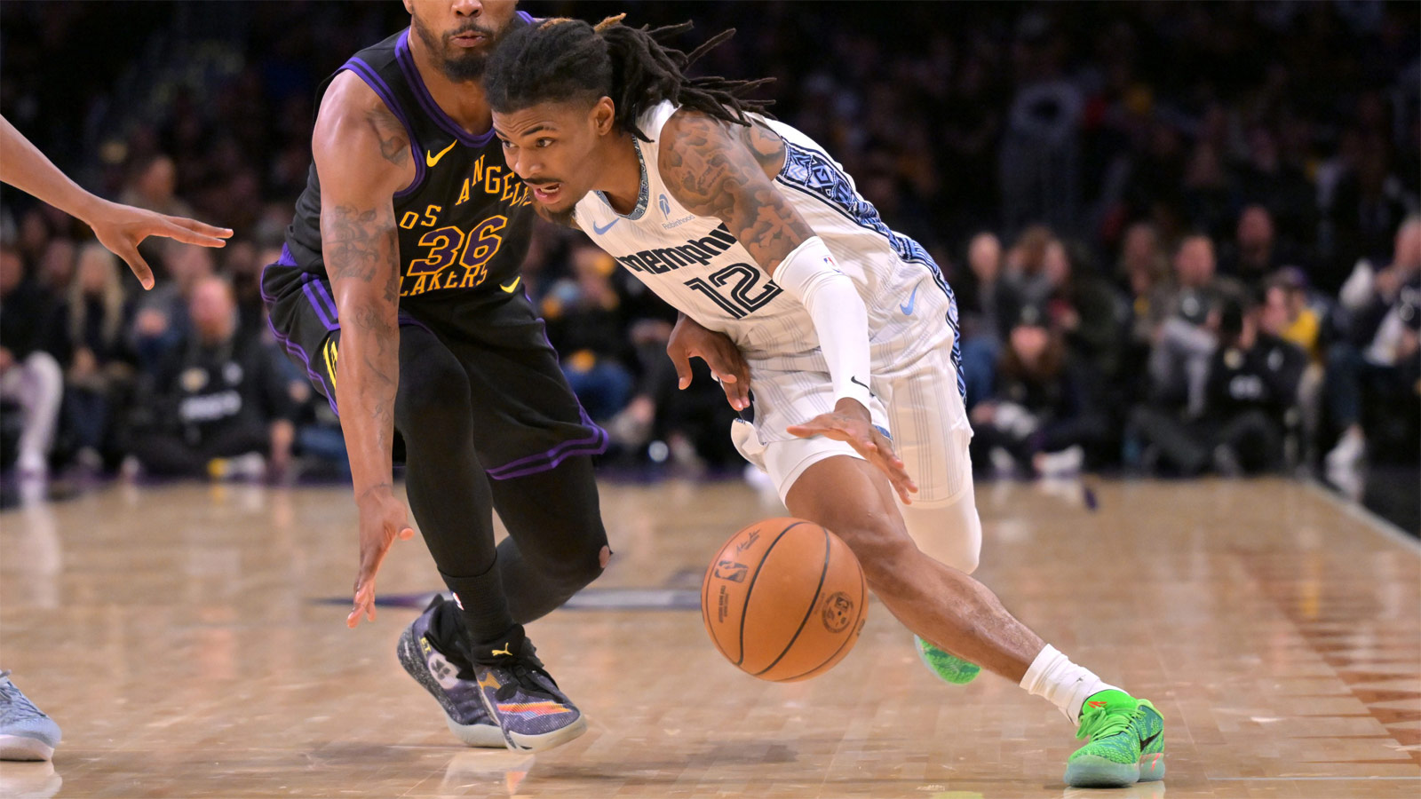 Los Angeles Lakers guard Marcus Smart (36) defends Memphis Grizzlies guard Ja Morant (12) as he drives to the basket in the second half at Crypto.com Arena. 