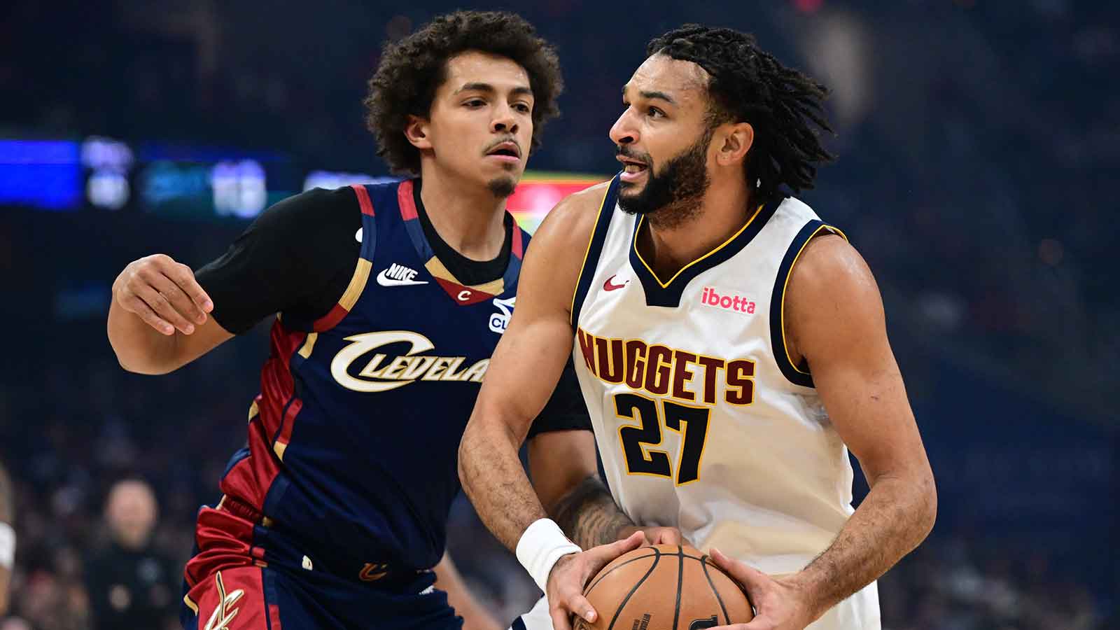 Denver Nuggets guard Jamal Murray (27) drives on Cleveland Cavaliers guard Craig Porter Jr. (9) during the first half at Rocket Arena. Mandatory Credit: David Dermer-Imagn Images