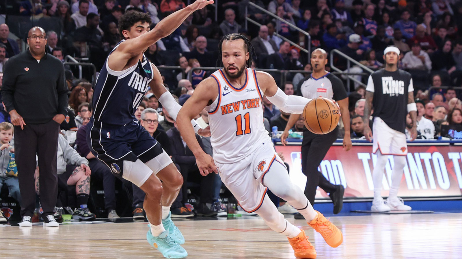 New York Knicks guard Jalen Brunson (11) drives past Dallas Mavericks guard Max Christie (00) in the first quarter at Madison Square Garden. Mandatory Credit: Wendell Cruz-Imagn Images