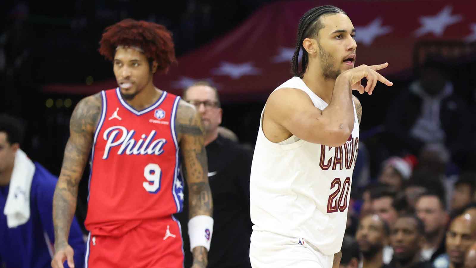 Cleveland Cavaliers guard Jaylon Tyson (20) reacts in front of Philadelphia 76ers guard Kelly Oubre Jr. (9) after his three pointer during the second quarter at Xfinity Mobile Arena.