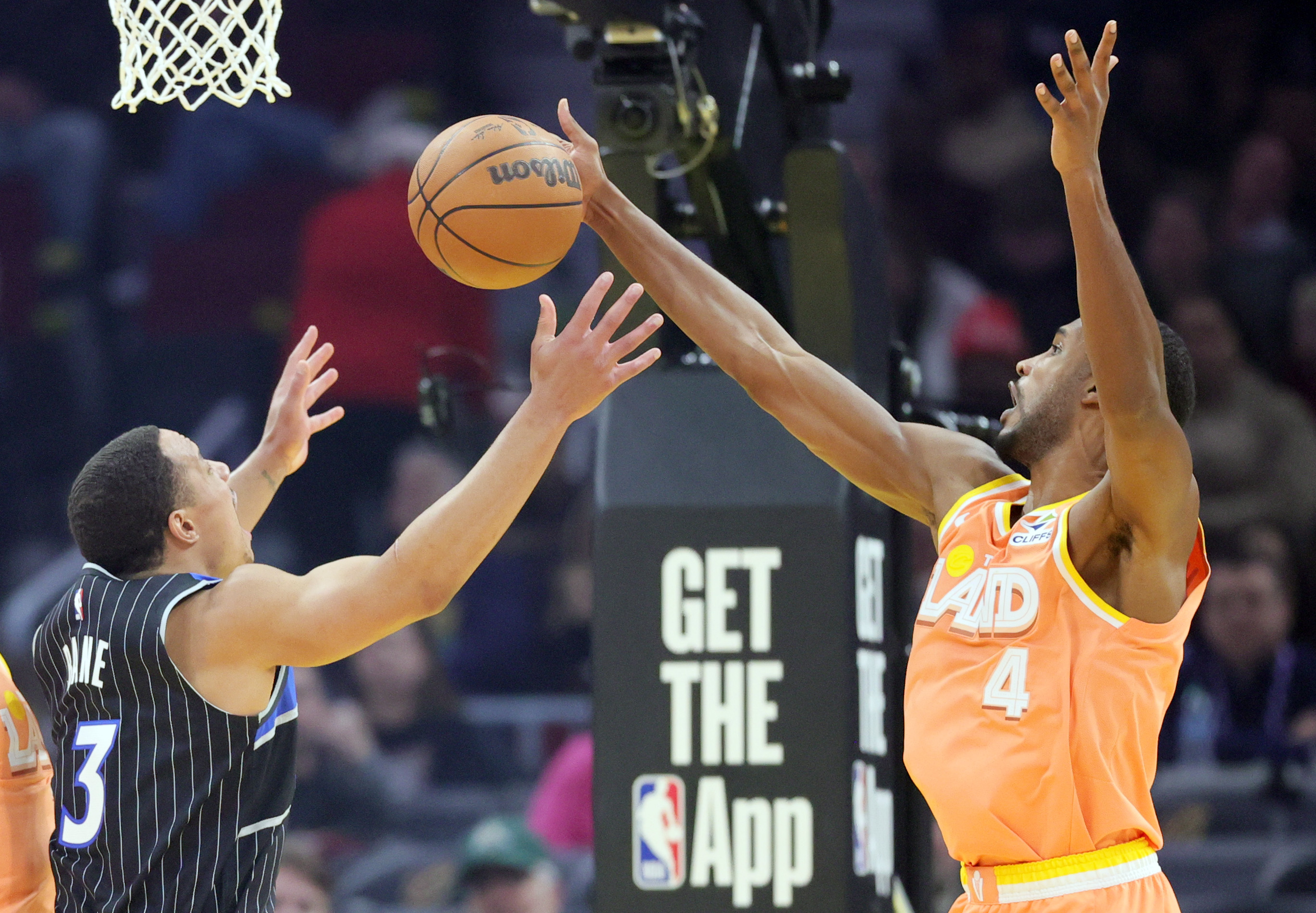 Cleveland Cavaliers center Evan Mobley (R) blocks the shot attempt by Orlando Magic guard Desmond Bane in the first half at Rocket Arena. 