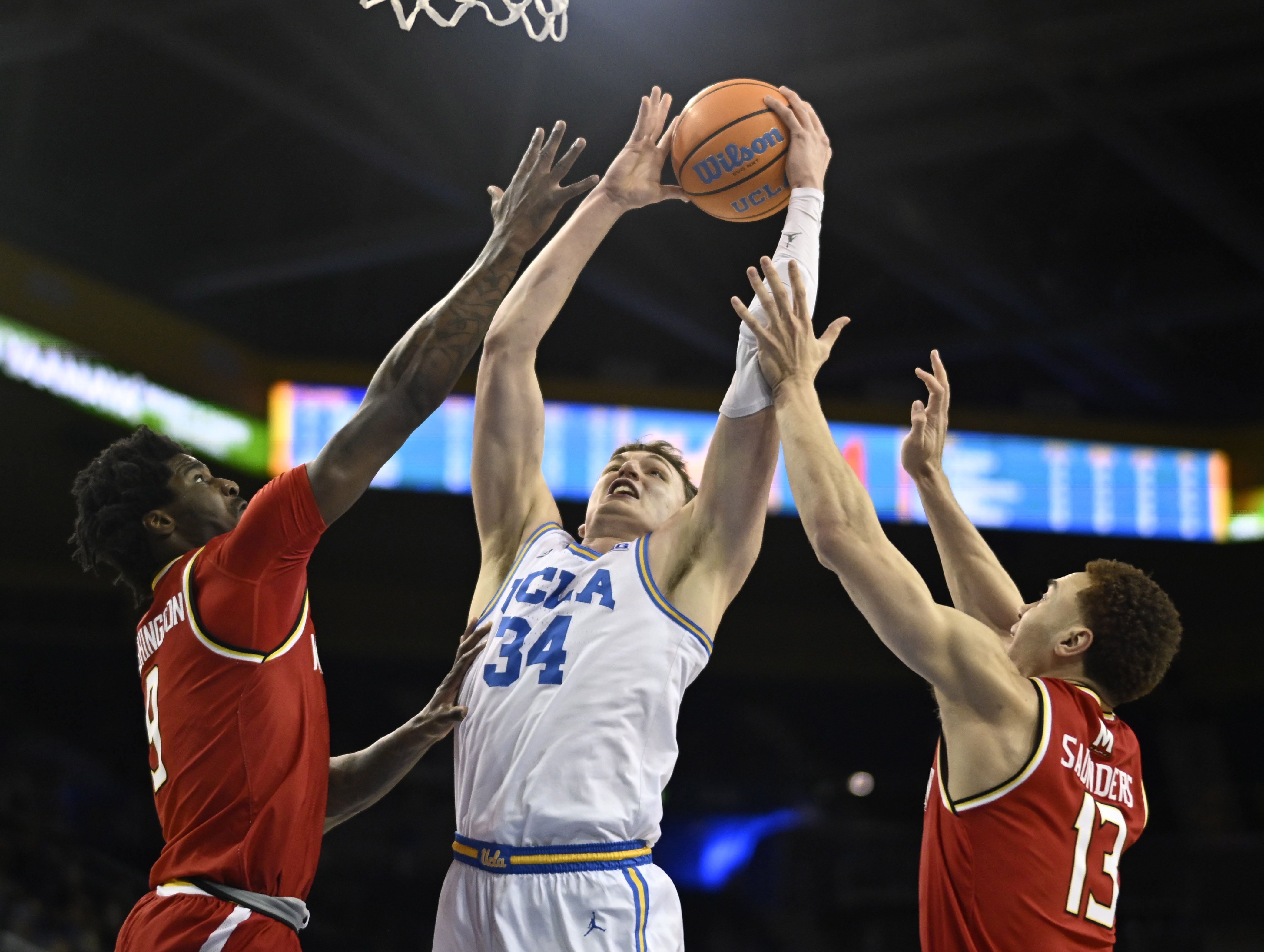 Forward Tyler Bilodeau #34 of the UCLA Bruins drives to...