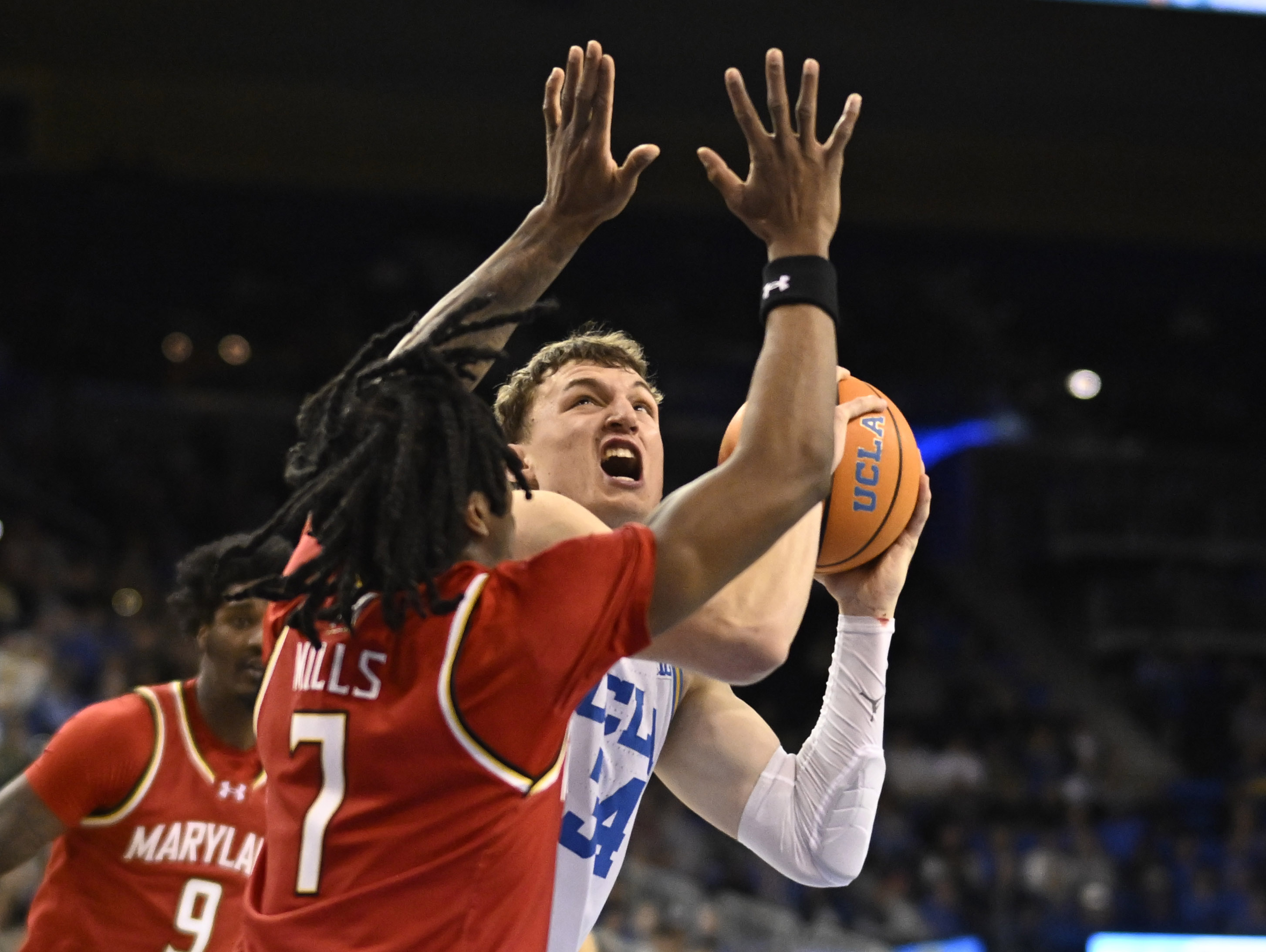 Forward Tyler Bilodeau #34 of the UCLA Bruins drives to...