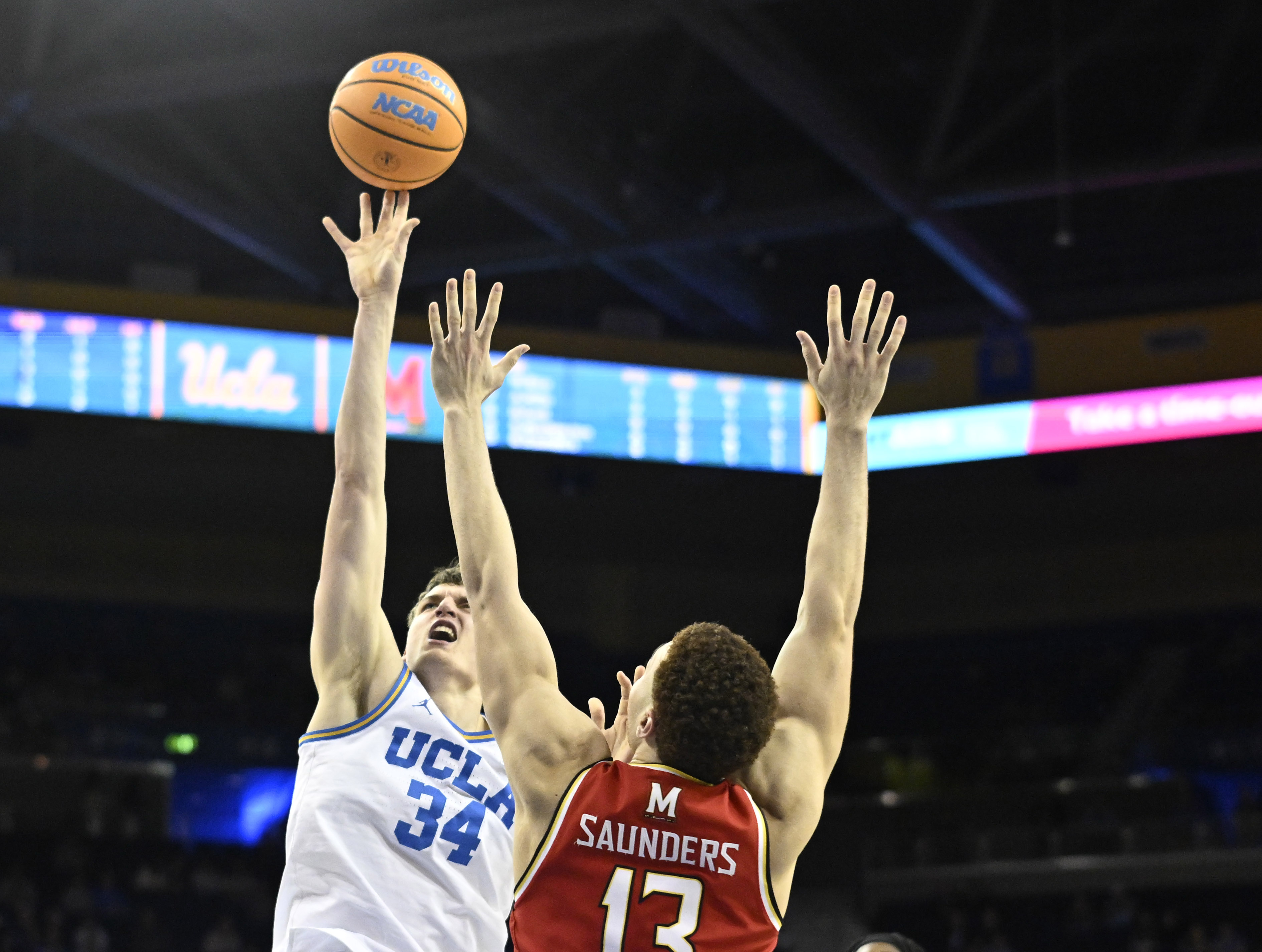 Forward Tyler Bilodeau #34 of the UCLA Bruins shoots over...