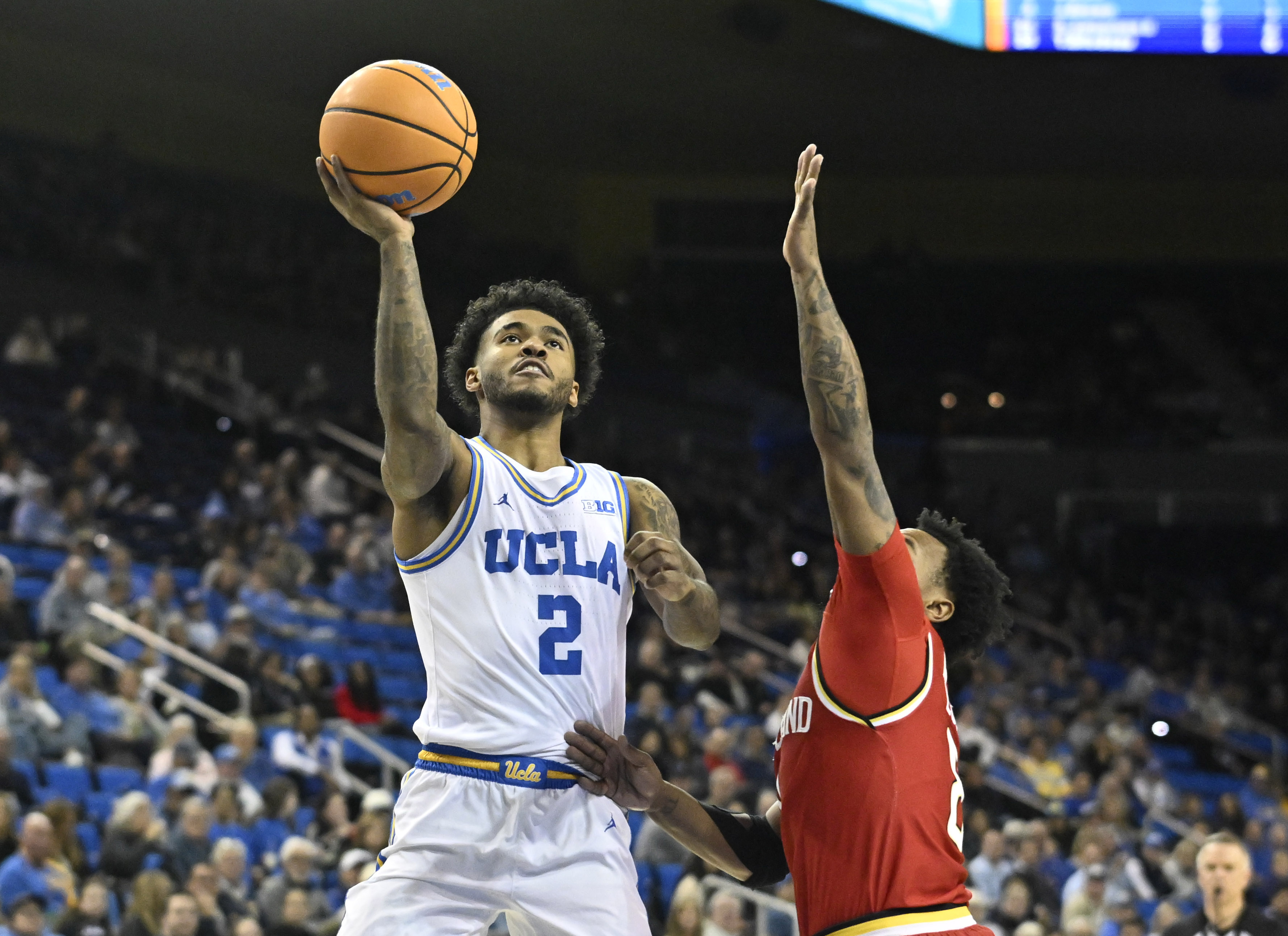 Guard Donovan Dent #2 of the UCLA Bruins shoots against...