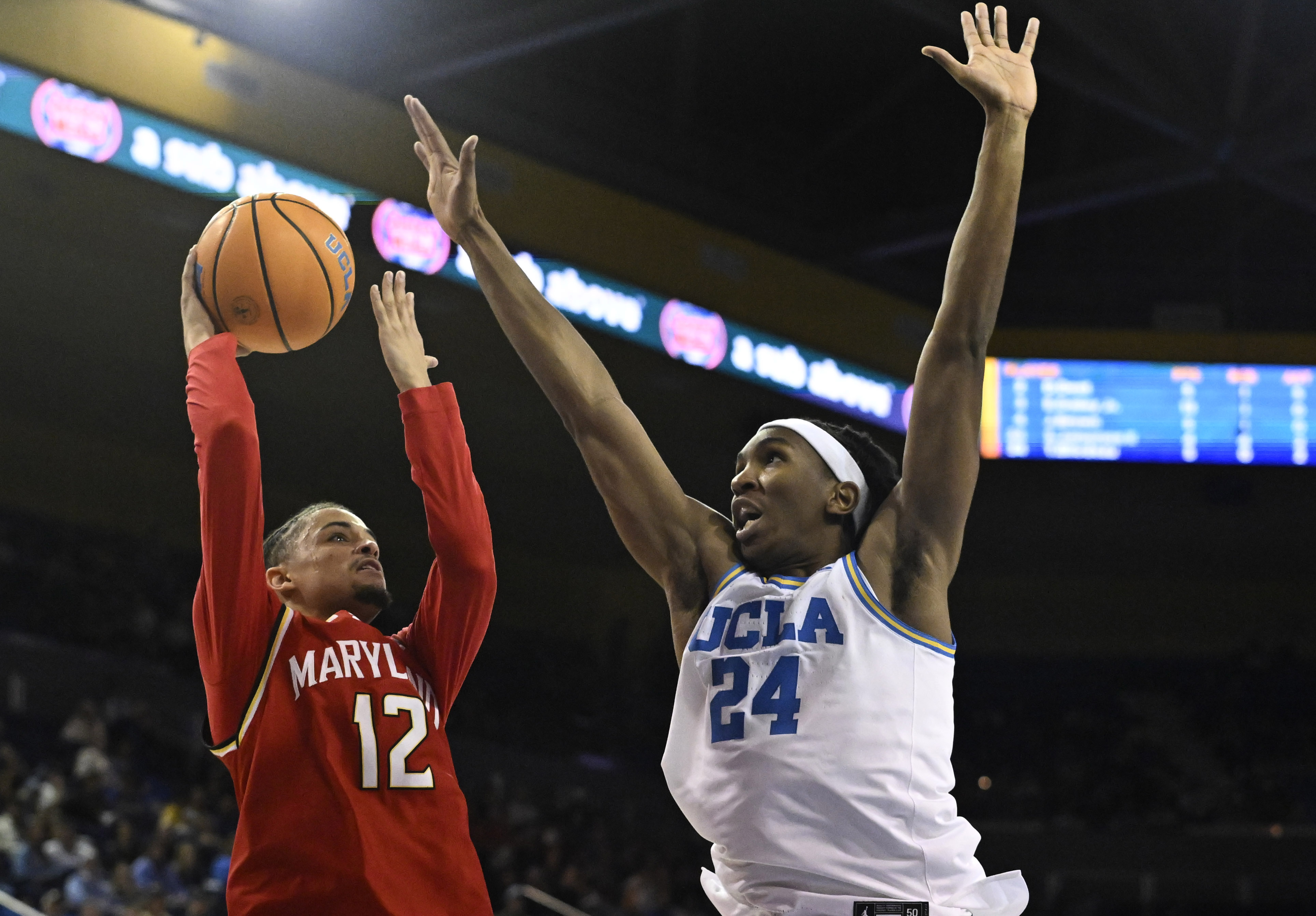 Guard Isaiah Watts #12 of the Maryland Terrapins drives to...