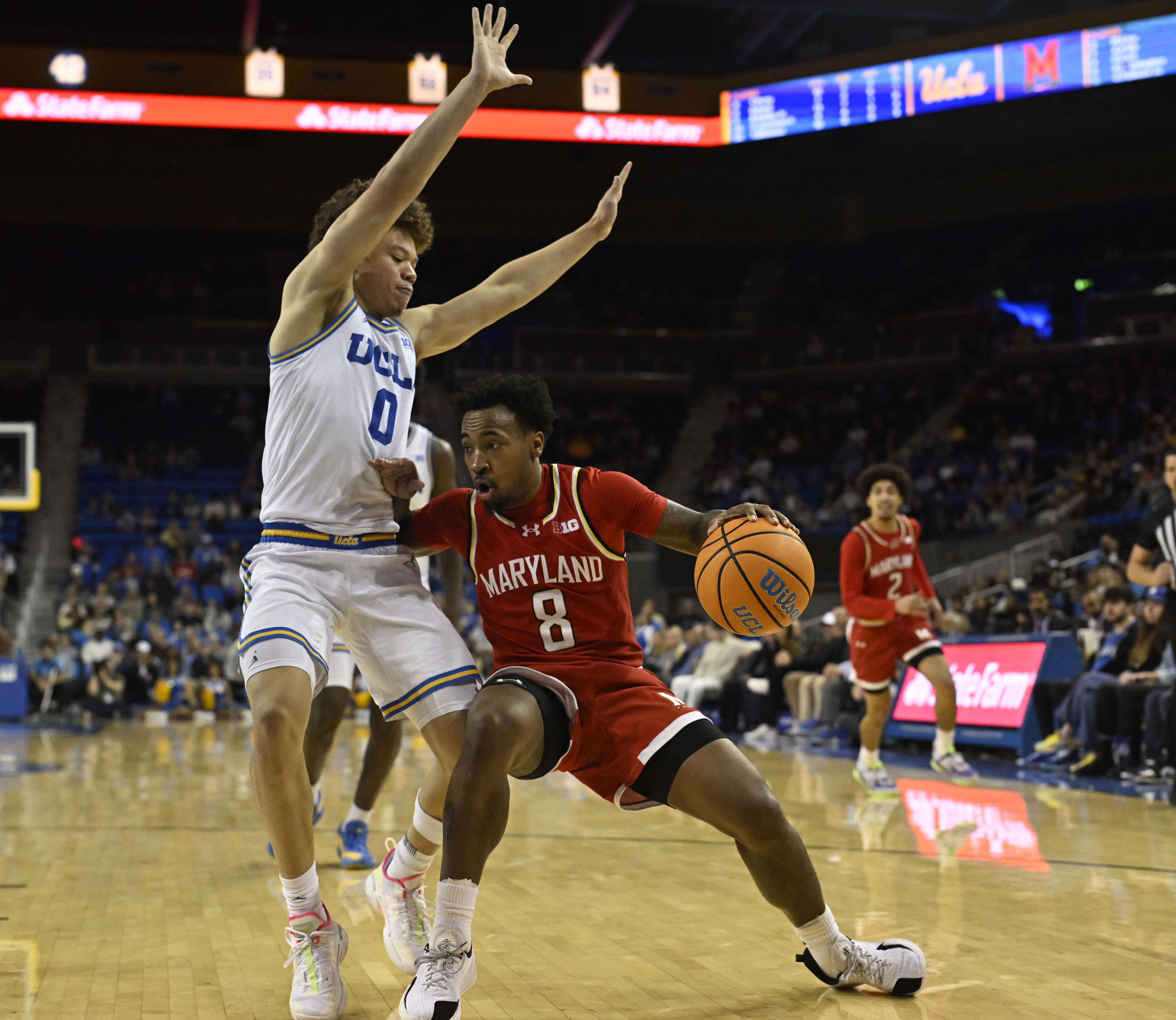 Guard David Coit #8 of the Maryland Terrapins drives to...