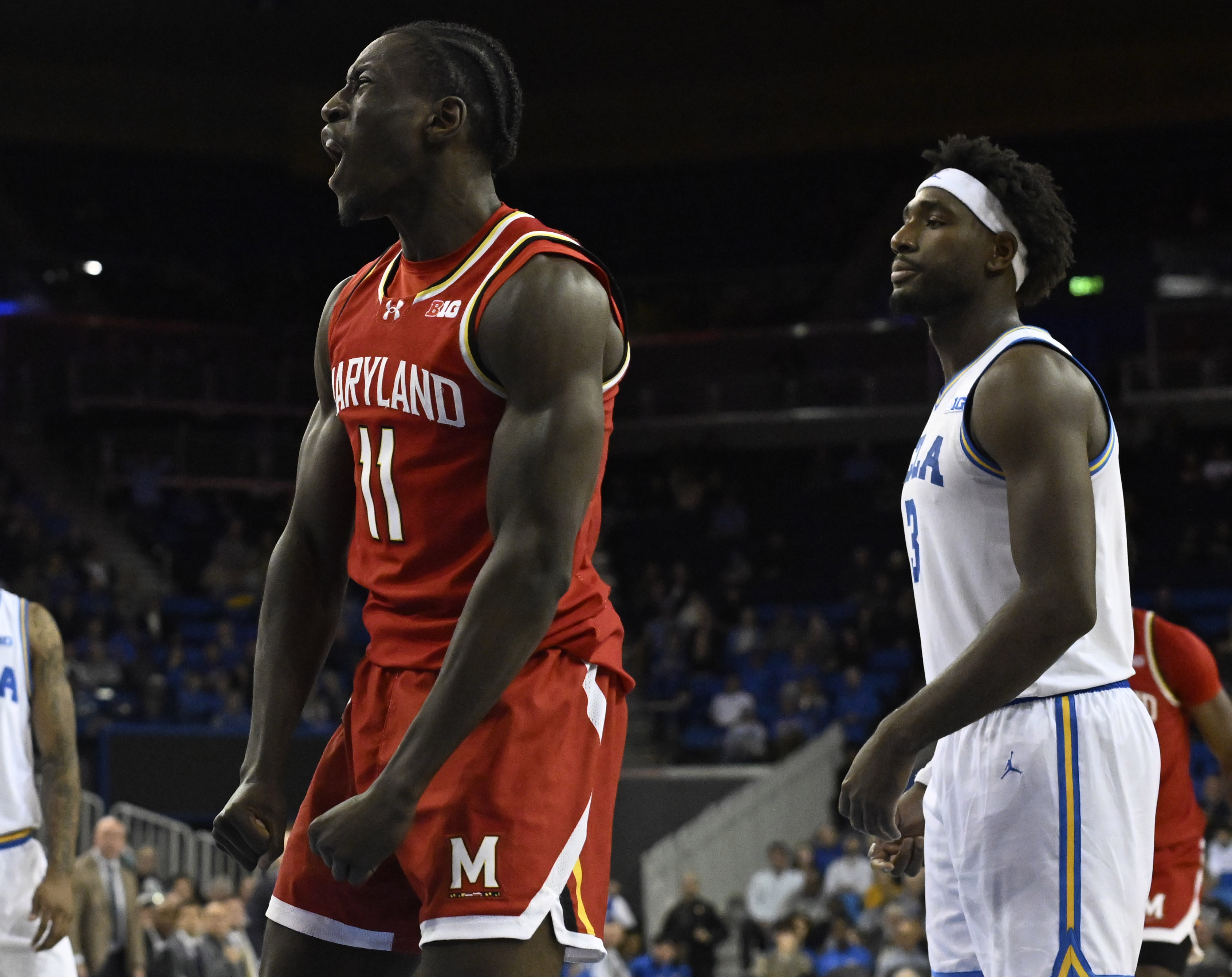 Guard George Turkson Jr. #11 of the Maryland Terrapins reacts...