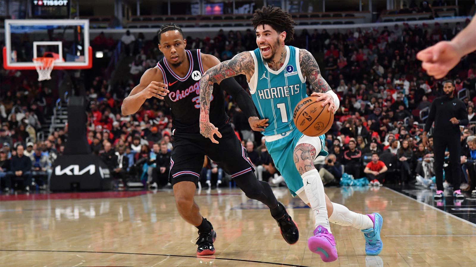 Charlotte Hornets guard Lamelo Ball (1) drives the ball against Chicago Bulls forward Isaac Okoro (35) during the first half at United Center. 