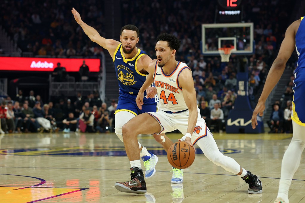 Landry Shamet, who scored six points, drives on Stephen Curry during the Knicks' 126-113 road loss to the Warriors on Jan. 15, 2026.