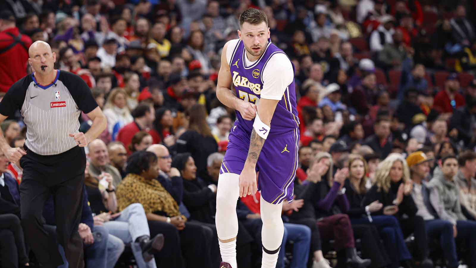 Los Angeles Lakers guard Luka Doncic (77) reacts after scoring against the Chicago Bulls during the first half at United Center.