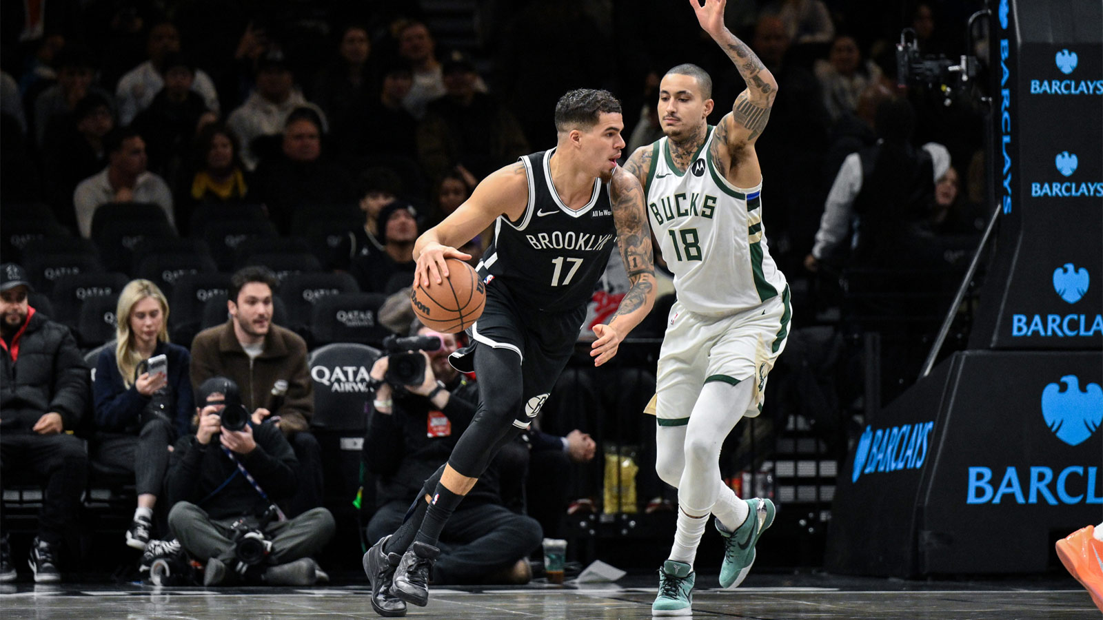 Brooklyn Nets forward Michael Porter Jr. (17) looks to shoot the ball as Milwaukee Bucks forward Kyle Kuzma (18) defends during the first half at Barclays Center.