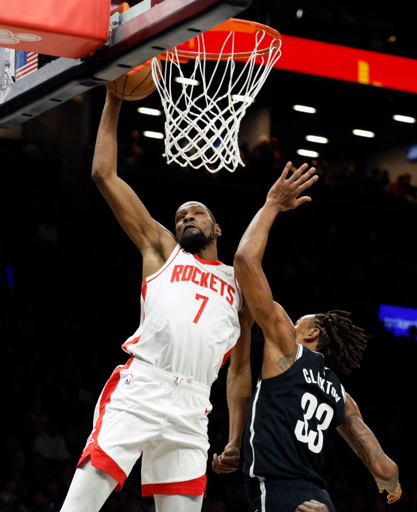 Kevin Durant #7 of the Houston Rockets slams the ball over Nic Claxton #33 of the Brooklyn Nets in the first half at the Barclays Center in Brooklyn, New York, Thursday, January 01, 2026. 