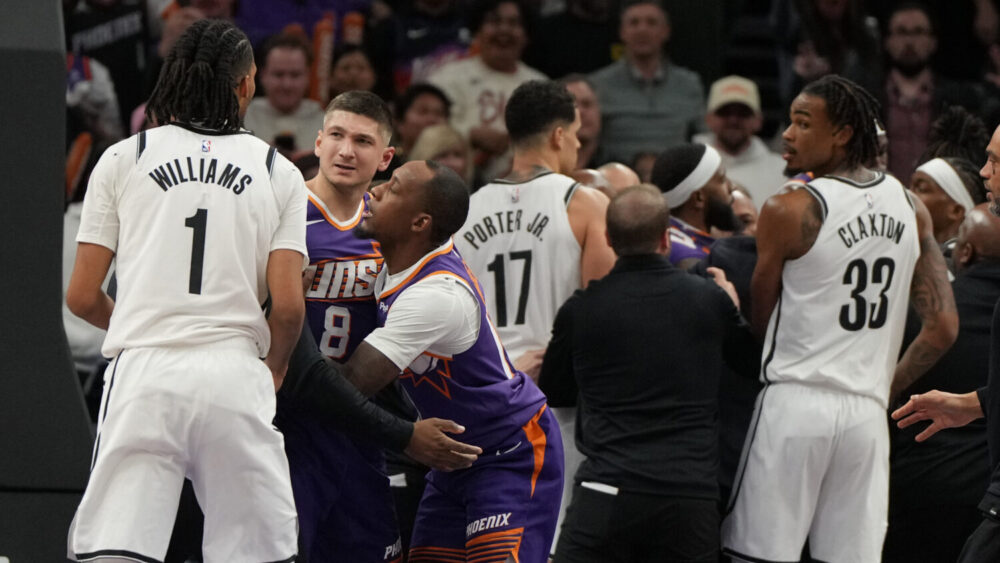 Phoenix Suns guard Grayson Allen (8) and Brooklyn Nets forward Ziaire Williams (1) get separated du...