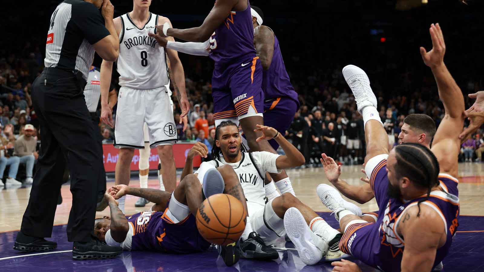 Brooklyn Nets guard Egor Demin (8) reacts after pushing Phoenix Suns forward Dillon Brooks to the ground to start a fight in the second half at Mortgage Matchup Center.