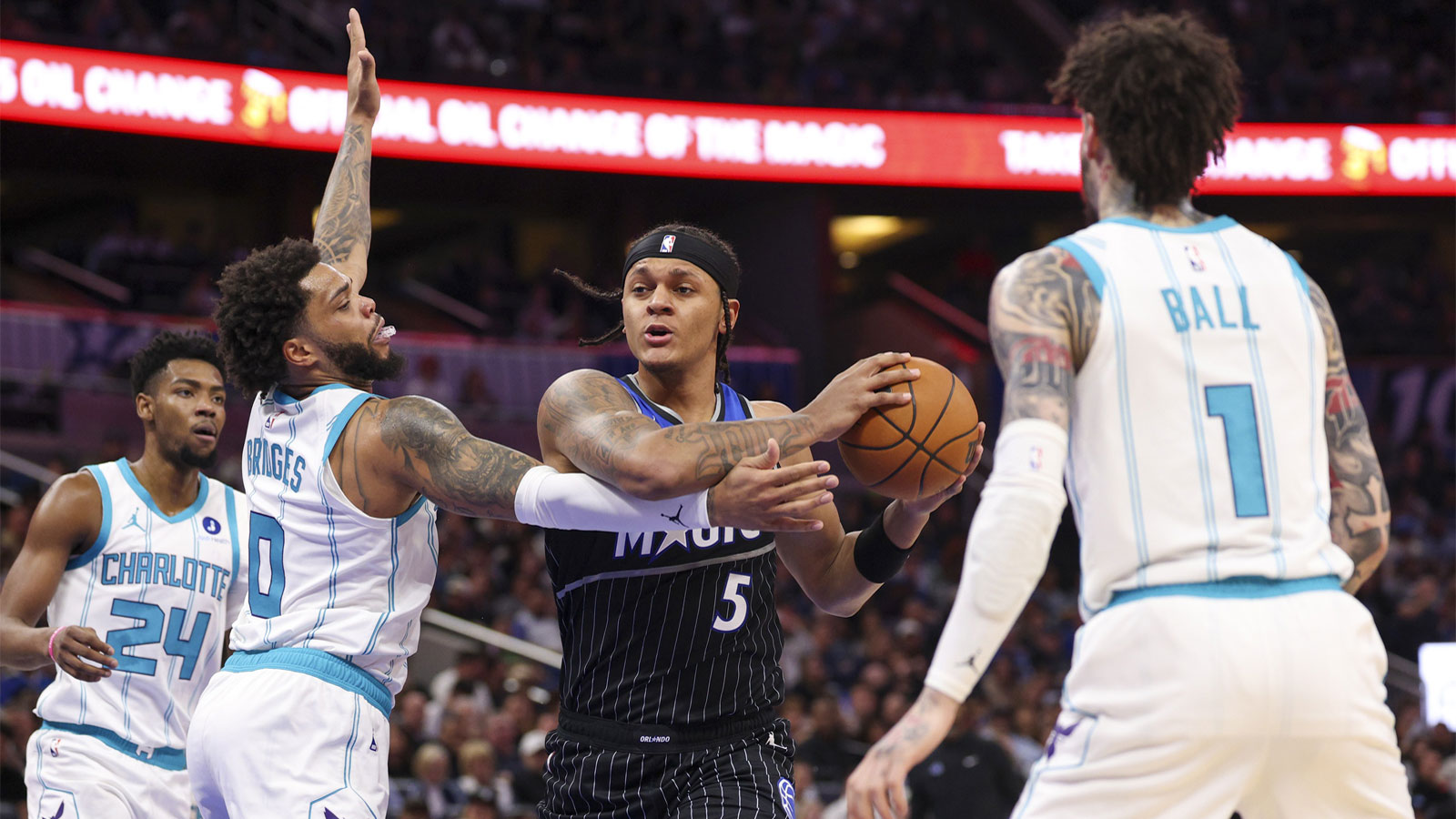 Orlando Magic forward Paolo Banchero (5) drives to the basket past Charlotte Hornets forward Miles Bridges (0) in the second quarter at Kia Center. 