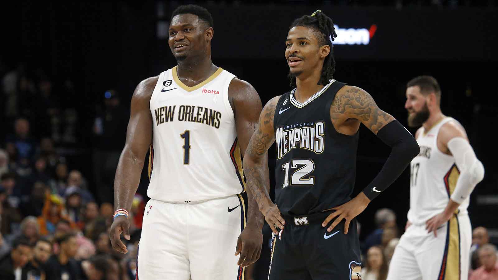 New Orleans Pelicans forward Zion Williamson (1) and Memphis Grizzlies guard Ja Morant (12) talk during free throws during the second half at FedExForum.