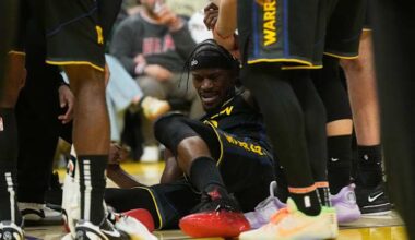 Warriors guard Jimmy Butler goes down with right knee injury in 3rd quarter against Heat