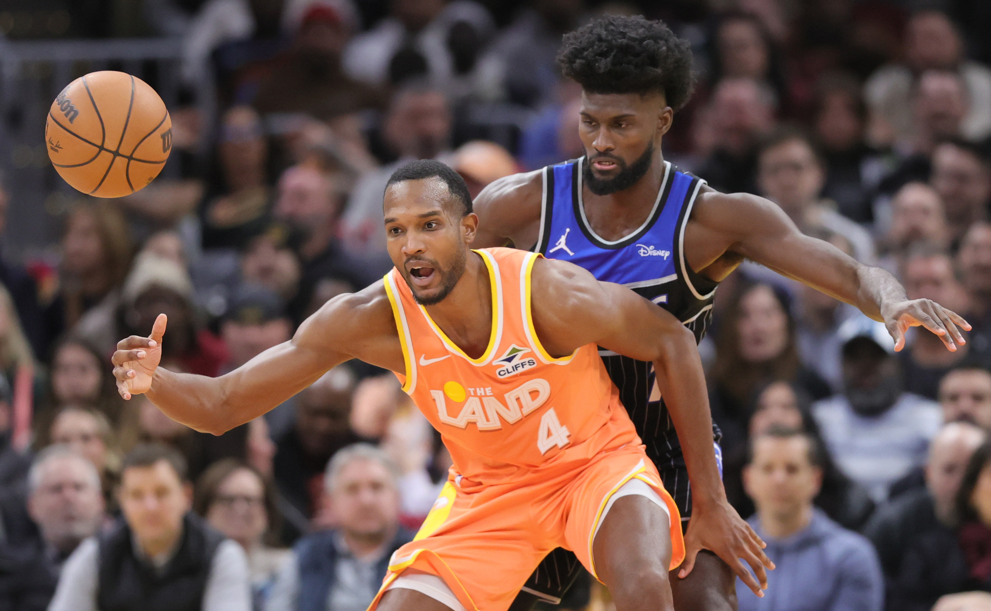 Cleveland Cavaliers center Evan Mobley loses control of the basketball guarded by Orlando Magic forward Jonathan Isaac in the second half. 
