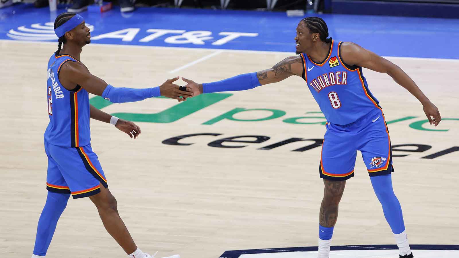 Oklahoma City Thunder guard/forward Jalen Williams (8) celebrates with Oklahoma City Thunder guard Shai Gilgeous-Alexander (2) after he scored against the San Antonio Spurs during the second half at Paycom Center. 