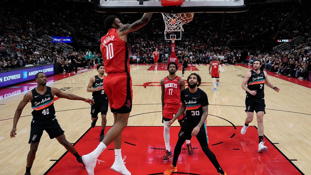 Houston Rockets forward Jabari Smith Jr. (10) dunks during the first half of an NBA basketball game against the San Antonio Spurs in Houston, Tuesday, Jan. 20, 2026. (AP Photo/Ashley Landis)