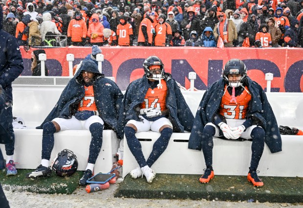 Lil'Jordan Humphrey (17), Courtland Sutton (14) and Kris Abrams-Draine (31) of the Denver Broncos sit on the bench as the clock ticks down during the fourth quarter of the New England Patriots' 10-7 AFC Championship Game win at Empower Field at Mile High in Denver on Sunday, Jan. 25, 2026. (Photo by AAron Ontiveroz/The Denver Post)