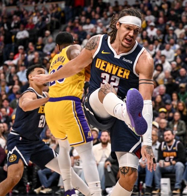 Aaron Gordon (32) of the Denver Nuggets reacts to being boxed out by Rui Hachimura (28) of the Los Angeles Lakers during the second quarter at Ball Arena in Denver, Colorado on Tuesday, January 20, 2026. (Photo by AAron Ontiveroz/The Denver Post)