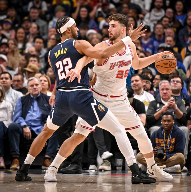 Zeke Nnaji (22) of the Denver Nuggets defends Alperen Sengun (28) of the Houston Rockets during the second quarter at Ball Arena in Denver, Colorado on Monday, Dec. 15, 2025. (Photo by AAron Ontiveroz/The Denver Post)