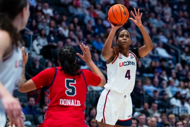 HARTFORD, CONNECTICUT - JANUARY 07: Blanca Quinonez #4 of the Connecticut Huskies shoots against Jailah Donald #5 of the St. John's Red Storm during the first half of an NCAA women's basketball game at PeoplesBank Arena on January 07, 2026 in Hartford, Connecticut. (Photo by Joe Buglewicz/Getty Images)