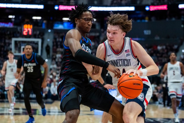 Braylon Mullins #24 of the Connecticut Huskies against Layden Blocker #2 of the DePaul Blue Demons during the first half of an NCAA men's basketball game at PeoplesBank Arena on January 10, 2026 in Hartford, Connecticut. (Photo by Joe Buglewicz/Getty Images)