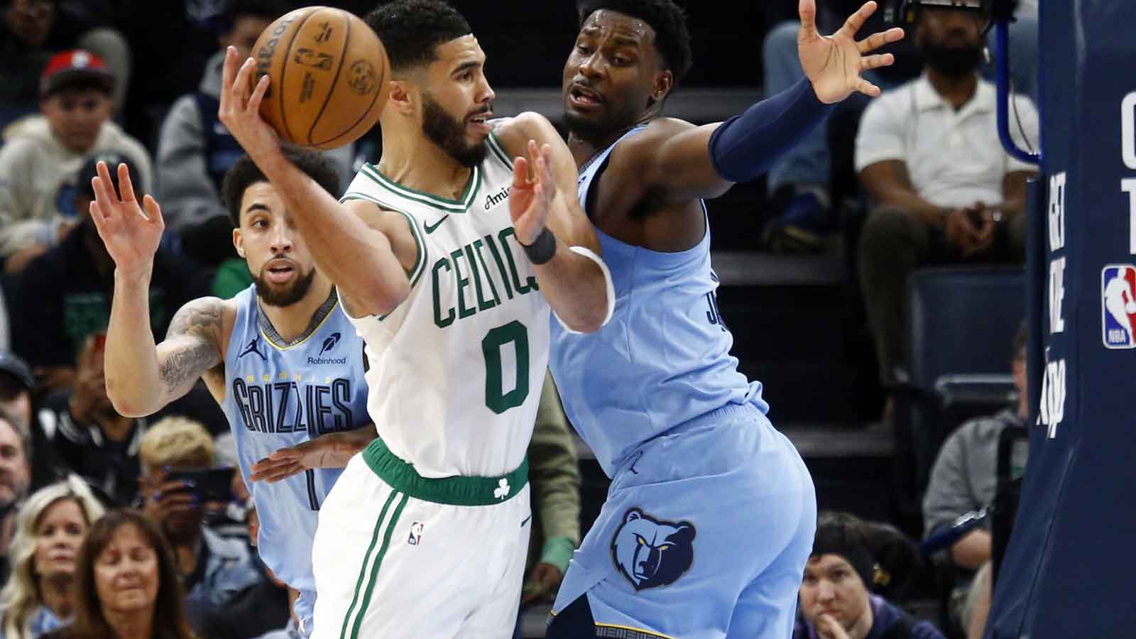 Boston Celtics forward Jayson Tatum (0) passes the ball as Memphis Grizzlies forward Jaren Jackson Jr. (13) defends during the fourth quarter at FedExForum.