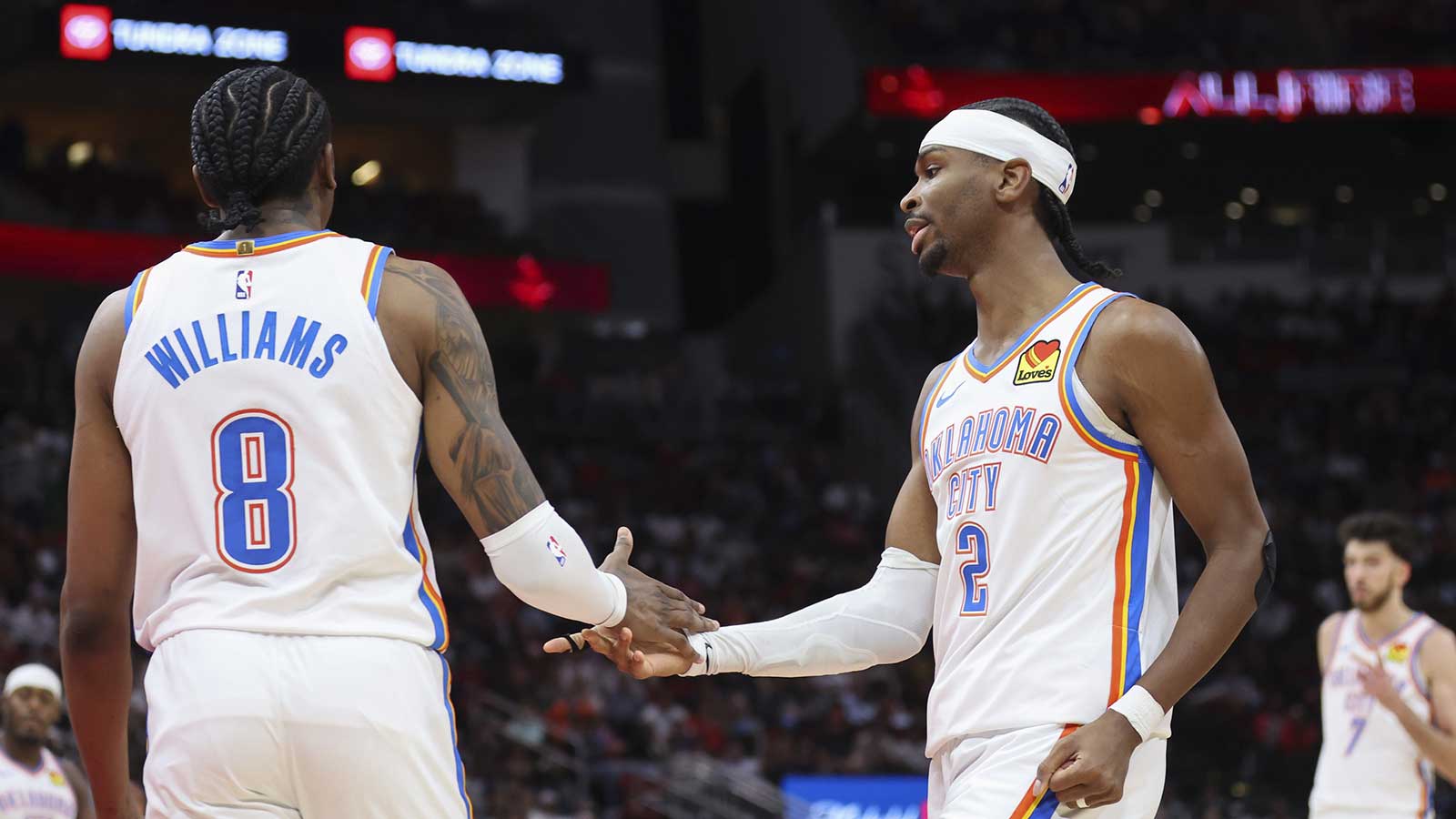 Thunder guard Jalen Williams (8) and guard Shai Gilgeous-Alexander (2) react after a play during the third quarter against the Houston Rockets at Toyota Center