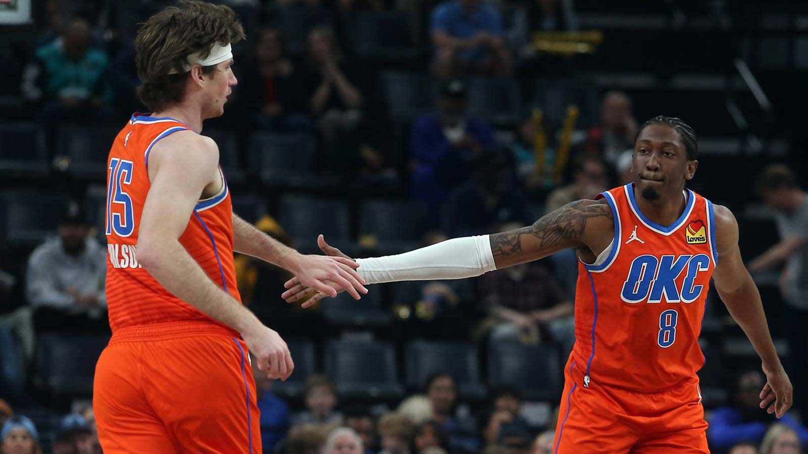 Thunder guard Jalen Williams (8) reacts with center Branden Carlson (15) during the first quarter against the Memphis Grizzlies at FedExForum