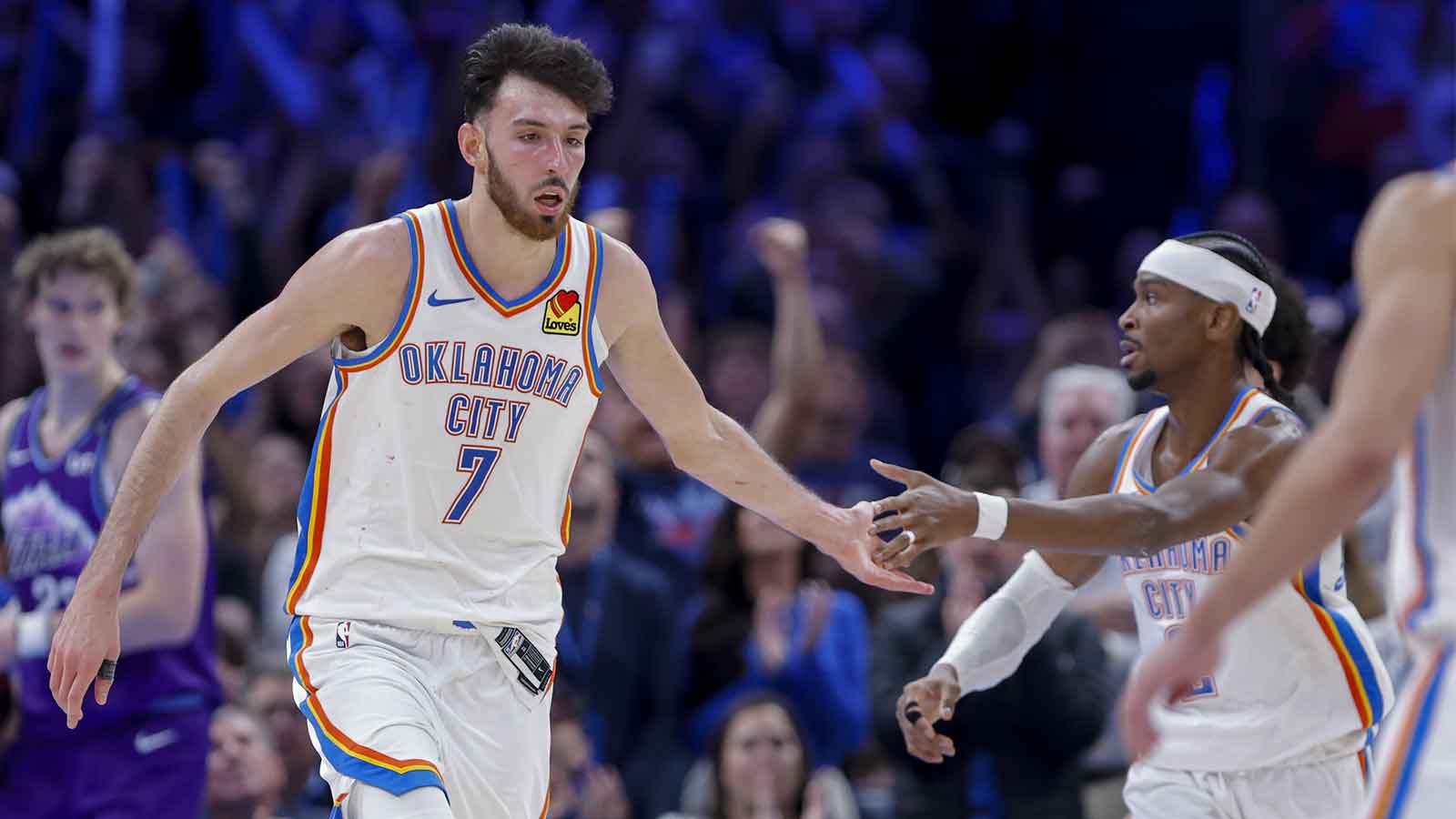 Thunder center/forward Chet Holmgren (7) and Oklahoma City Thunder guard Shai Gilgeous-Alexander (2) celebrate after a basket during overtime against the Utah Jazz at Paycom Center