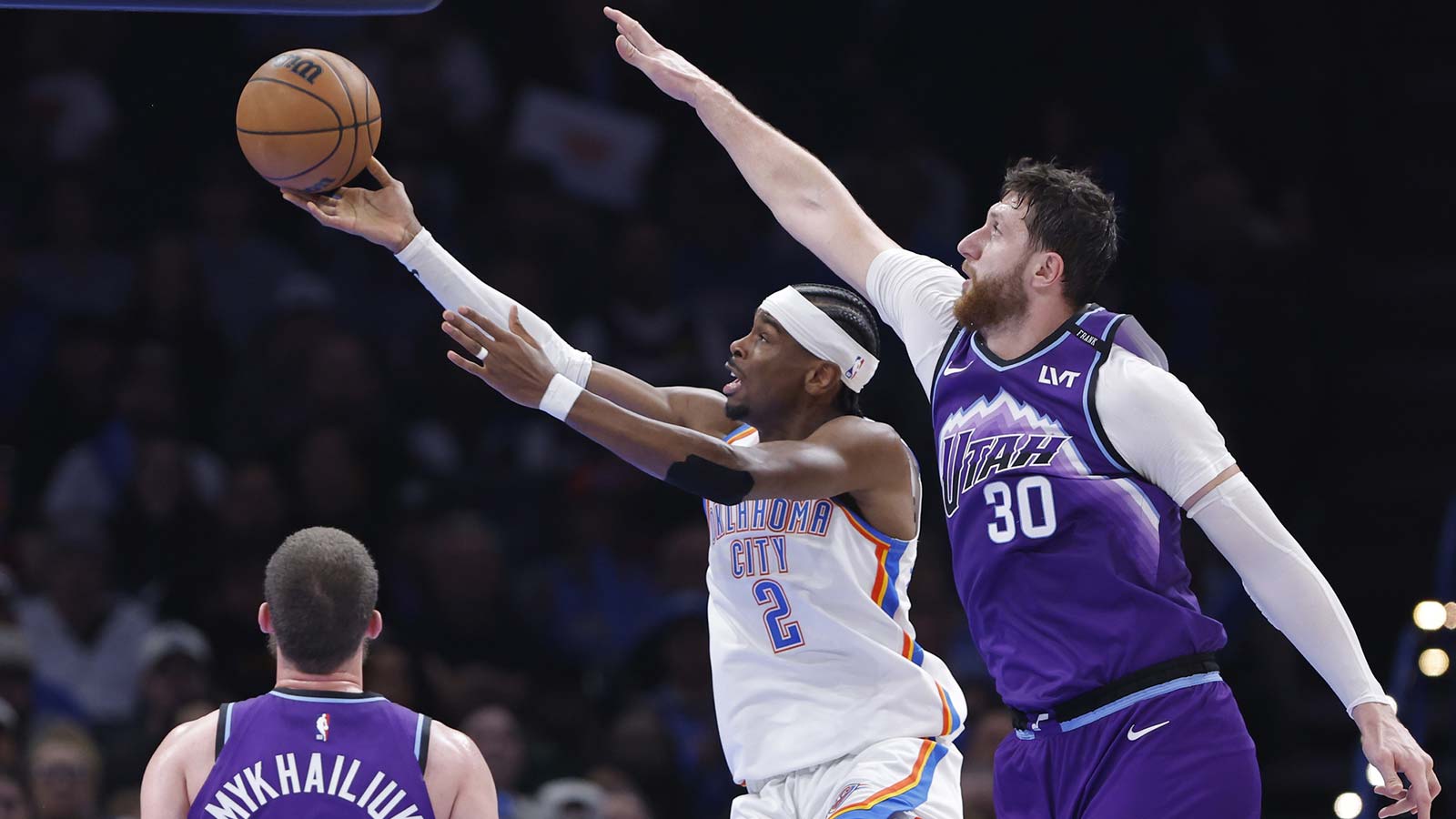 Thunder guard Shai Gilgeous-Alexander (2) goes up for a basket in front of Utah Jazz center Jusuf Nurkić (30) during the second half at Paycom Center