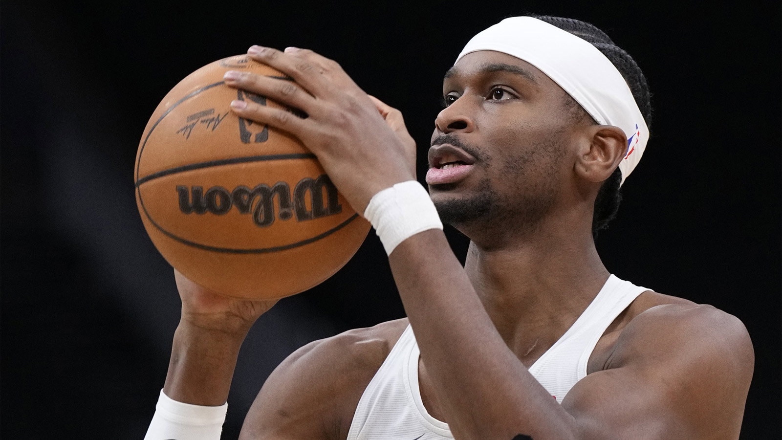 Thunder guard Shai Gilgeous-Alexander (2) takes a shot during pregame warmups before a game against the Milwaukee Bucks at Fiserv Forum