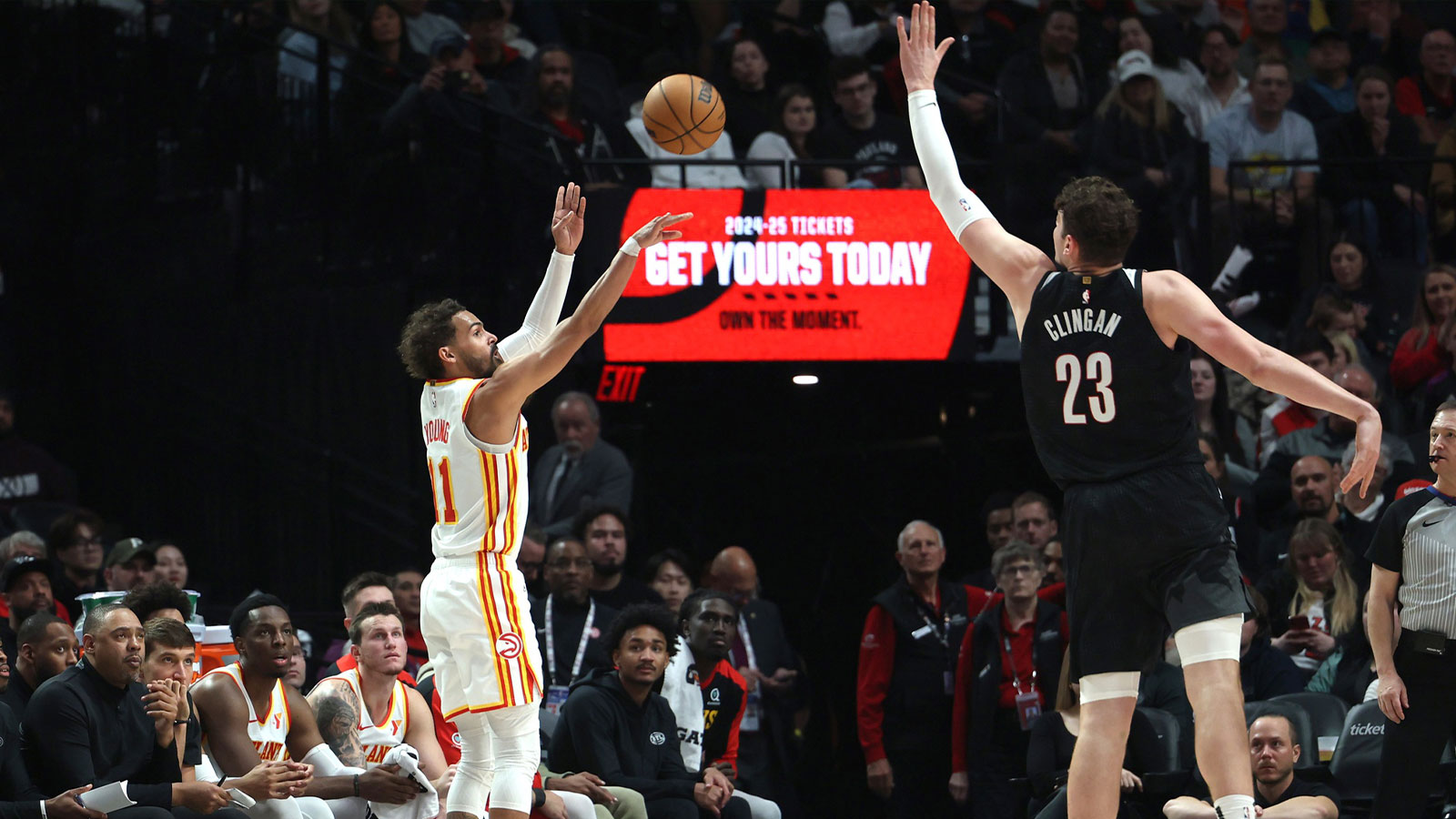 Atlanta Hawks guard Trae Young (11) shoots the ball over Portland Trail Blazers center Donovan Clingan (23) in the first half at Moda Center. 