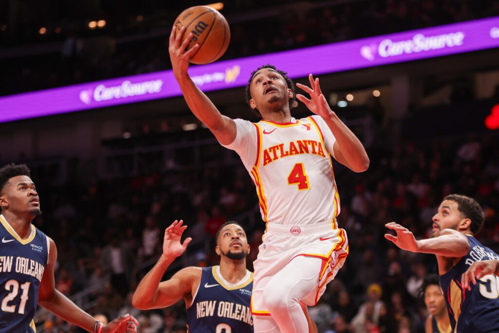 Dec 2, 2024; Atlanta, Georgia, USA; Atlanta Hawks guard Kobe Bufkin (4) shoots against the New Orleans Pelicans in the second quarter at State Farm Arena. Mandatory Credit: Brett Davis-Imagn Images