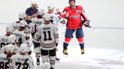 Apr 4, 2025; Washington, District of Columbia, USA; Washington Capitals left wing Alex Ovechkin (8) greets Chicago Blackhawks players after scoring the 894th of Ovechkin’s career, tying Wayne Gretzky (not pictured) for most all-time goals scored in the NHL. Mandatory Credit: Amber Searls-Imagn Images at Capital One Arena. Mandatory Credit: Amber Searls-Imagn Images