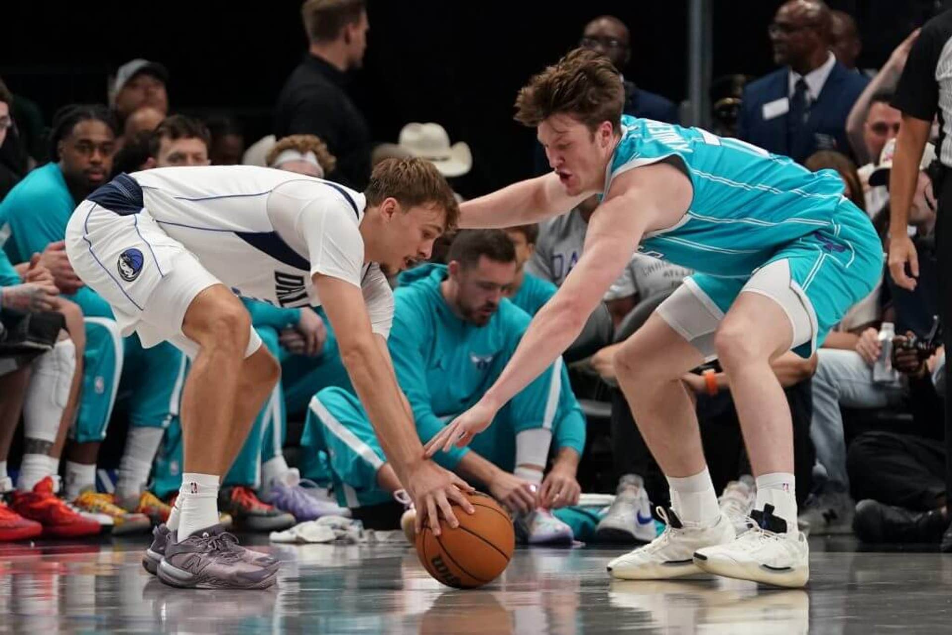 Oct 11, 2025; Dallas, Texas, USA; Dallas Mavericks forward Cooper Flagg (32) and Charlotte Hornets guard/forward Kon Knueppel (7) battle for the loose ball